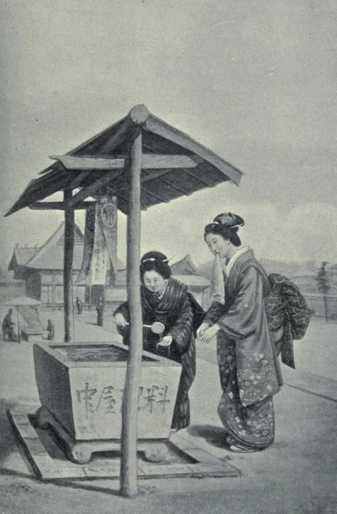 手水舎で手を清める女たち。明治時代の画像。